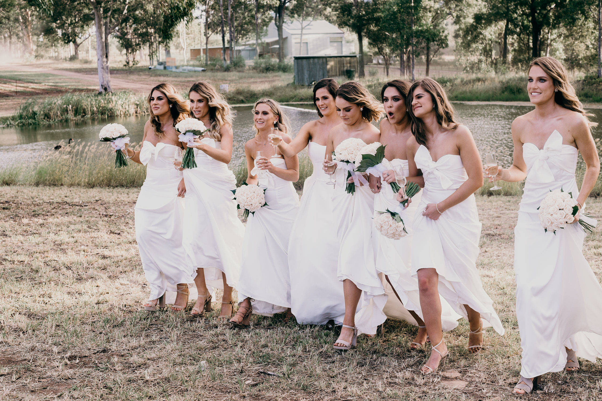 Classy bridesmaids looking after their bride image